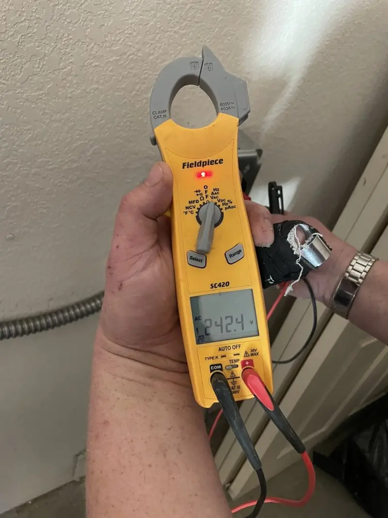 Voltage testing with clamp meter during Ceiling Fan Installation in Bailey's Crossroads